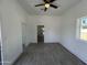 Open-concept living room showcasing neutral walls, modern flooring, and a doorway leading to other areas of the house at 824 S 3Rd Ave, Phoenix, AZ 85003