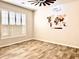 Spacious bedroom with a ceiling fan, shuttered windows, and a decorative world map on the wall at 8386 E Arroyo Seco Rd, Scottsdale, AZ 85266