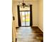 Bedroom with sliding glass door leading to the backyard and wood-look tile flooring at 8386 E Arroyo Seco Rd, Scottsdale, AZ 85266