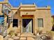 Inviting front entrance featuring a spiral staircase to the rooftop patio and beautiful desert landscaping at 8386 E Arroyo Seco Rd, Scottsdale, AZ 85266