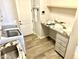 Bright laundry room with granite countertops, modern appliances, and a functional workspace at 8386 E Arroyo Seco Rd, Scottsdale, AZ 85266