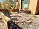 Outdoor patio with desert landscaping and access to a gated outdoor living space at 8386 E Arroyo Seco Rd, Scottsdale, AZ 85266