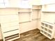 Spacious walk-in closet with custom shelves, drawers, and ample storage space for organization at 8386 E Arroyo Seco Rd, Scottsdale, AZ 85266