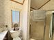 The bathroom has a shower with glass doors, a sink, and a nice window at 864 S Motherlode Dr, Apache Junction, AZ 85119