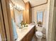 This bathroom features wood accents, a white sink, and lots of light at 864 S Motherlode Dr, Apache Junction, AZ 85119