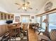 Bright dining area features an adjacent sitting area, rich wood tones, and lots of natural light at 864 S Motherlode Dr, Apache Junction, AZ 85119