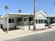 Charming single-story home with covered parking, a front patio, and desert landscaping at 864 S Motherlode Dr, Apache Junction, AZ 85119