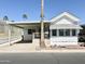 Charming single-story home with covered parking, a front patio, and desert landscaping at 864 S Motherlode Dr, Apache Junction, AZ 85119