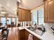 A bright kitchen featuring oak cabinets and a stainless steel sink at 864 S Motherlode Dr, Apache Junction, AZ 85119