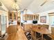 Bright kitchen with wood cabinetry, white countertops, and adjacent dining area with seating for four at 864 S Motherlode Dr, Apache Junction, AZ 85119