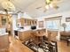 Eat-in kitchen featuring wood cabinets, and an adjoining dining area with round table at 864 S Motherlode Dr, Apache Junction, AZ 85119