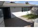 Backyard with green lawn, brick patio, and white wall at 925 W Mcdowell Rd # 102, Phoenix, AZ 85007