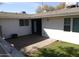 Backyard features a brick patio and green grass at 925 W Mcdowell Rd # 102, Phoenix, AZ 85007