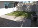 Fenced backyard with brick patio, lawn and concrete walls at 925 W Mcdowell Rd # 102, Phoenix, AZ 85007