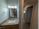 Bathroom with a framed mirror, granite counters and towel rack at 925 W Mcdowell Rd # 102, Phoenix, AZ 85007