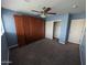 Bedroom with Murphy bed, ceiling fan, closet and an open door at 925 W Mcdowell Rd # 102, Phoenix, AZ 85007