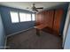 This bedroom features a murphy bed with side tables pulled down at 925 W Mcdowell Rd # 102, Phoenix, AZ 85007