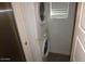 Laundry closet with stacked washer and dryer and tile floors at 925 W Mcdowell Rd # 102, Phoenix, AZ 85007