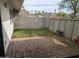 Enclosed brick patio with green grass and block wall at 925 W Mcdowell Rd # 102, Phoenix, AZ 85007