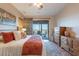 Bedroom with a sliding glass door to patio, desert views, wood furniture, and decorative accents at 9431 N Summer Hill Blvd, Fountain Hills, AZ 85268