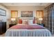 Bedroom with neutral tones, shutters, bedside tables with lamps, and a bed with decorative pillows at 9431 N Summer Hill Blvd, Fountain Hills, AZ 85268