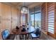 Bright breakfast nook with wood shutters and a table set for a wine and fruit with comfortable seating at 9431 N Summer Hill Blvd, Fountain Hills, AZ 85268