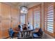 Bright breakfast nook with wood shutters and a table set for a wine and fruit with comfortable seating at 9431 N Summer Hill Blvd, Fountain Hills, AZ 85268