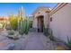 Inviting home entrance featuring desert landscaping, a stone walkway, and a neutral-toned facade at 9431 N Summer Hill Blvd, Fountain Hills, AZ 85268