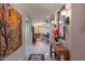 Hallway leading to the living room and dining area, featuring decorative mirror and artwork at 9431 N Summer Hill Blvd, Fountain Hills, AZ 85268