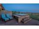 Outdoor hot tub with serene views, set on a brick patio with chairs for relaxing at 9431 N Summer Hill Blvd, Fountain Hills, AZ 85268