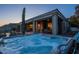 Backyard area featuring a hot tub, covered patio, and desert views at 9431 N Summer Hill Blvd, Fountain Hills, AZ 85268