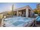 Outdoor hot tub next to the pool, with patio, cacti and seating at 9431 N Summer Hill Blvd, Fountain Hills, AZ 85268