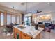 Kitchen features granite counters, an island with seating, with an open concept to the living room at 9431 N Summer Hill Blvd, Fountain Hills, AZ 85268