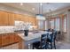 Open kitchen featuring granite counters, an island with seating, and pendant lighting above it at 9431 N Summer Hill Blvd, Fountain Hills, AZ 85268