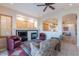 Relaxing living room with fireplace and views of the dining area at 9431 N Summer Hill Blvd, Fountain Hills, AZ 85268