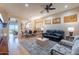 Spacious living room features a fireplace, elegant furniture, and wooden shutters at 9431 N Summer Hill Blvd, Fountain Hills, AZ 85268