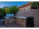 Outdoor kitchen features a built-in grill and smoker, perfect for entertaining in a private backyard setting at 9431 N Summer Hill Blvd, Fountain Hills, AZ 85268