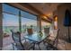 Covered patio featuring outdoor dining table and seating with scenic desert landscape views at 9431 N Summer Hill Blvd, Fountain Hills, AZ 85268