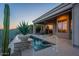 Outdoor pool and desert landscape, adjacent to the covered patio and open-concept sliding glass doors at 9431 N Summer Hill Blvd, Fountain Hills, AZ 85268