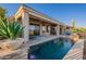 Backyard pool area with patio and lush greenery, perfect for relaxing and enjoying the outdoors at 9431 N Summer Hill Blvd, Fountain Hills, AZ 85268