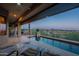 Inviting backyard swimming pool and desert landscape views from the covered patio at 9431 N Summer Hill Blvd, Fountain Hills, AZ 85268