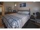 Bedroom featuring a decorative bed with a lovely blue pattern at 9550 E Thunderbird Road -- # 141, Scottsdale, AZ 85260