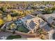 Expansive backyard with a private pool, putting green, and desert landscaping in a gated community at 9727 E Presidio Rd, Scottsdale, AZ 85260