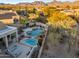 Aerial shot of a backyard featuring a pool, spa, and desert landscaping at 9727 E Presidio Rd, Scottsdale, AZ 85260