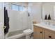 Bright bathroom featuring a modern vanity and a glass-enclosed shower with a showerhead at 9727 E Presidio Rd, Scottsdale, AZ 85260