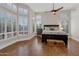 Bright bedroom boasts hardwood floors, plantation shutters, and neutral paint at 9727 E Presidio Rd, Scottsdale, AZ 85260