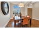 Elegant dining room with a wooden table, comfortable chairs, and a decorative light fixture at 9727 E Presidio Rd, Scottsdale, AZ 85260