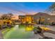 Backyard pool with desert landscaping, fire pit, and outdoor seating at 9727 E Presidio Rd, Scottsdale, AZ 85260