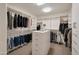 Walk-in closet with custom shelving and plentiful storage at 9727 E Presidio Rd, Scottsdale, AZ 85260