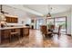 Bright dining room adjacent to kitchen featuring tile floor and backyard access at 9803 N 100Th Pl, Scottsdale, AZ 85258